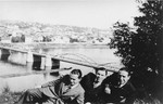 Three Jewish friends pose for a picture on the banks of the Nemanas River in Kovno.