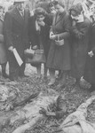 Families of the Jewish victims of the Maros Street Hospital massacre search among the exhumed corpses for relatives and friends.