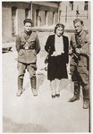 Three former Jewish partisans pose in the Vilna ghetto soon after the liberation.
