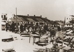 The furnishings of Jewish homes is collected and unloaded in a public square in the district of Wieniawa after the liquidation of the Lublin ghetto.