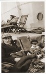 Jewish refugees sit on the deck of the SS Conte Verde while en route to Shanghai.
