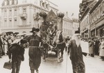 A troupe of actors in a carnival parade parodies Jewish life in Germany.