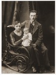 Studio portrait of Szmul Zygielbojm with his first wife, Golda Sperling Zygielbojm and their infant son, Yosef.