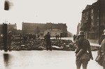 German soldiers patrol a public square in Czestochowa, where the bodies of those they shot have been collected.