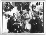 Propaganda slide featuring a series of pictures of religious Jews in various settings in Europe and Palestine.