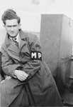 Willie Sterner wearing an MP armband poses on the deck of the SS Stewart while en route to Canada.