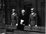 Defendant Ernst Von Weizsaecker, flanked by two guards from the U.