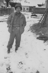 A Japanese-American soldier with the 522nd Field Artillery battalion poses outside in the snow in Waakirchen, Germany.