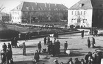 Jewish DPs gather in a central square of the Eschwege displaced persons camp following a raid by American military police searching for contraband.
