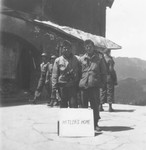 Royce Higa (left) and Hideo Nakamine (right), Japanese-American soldiers with the 522nd Field Artillery battalion, pose outside the destroyed Berghof, Hitler's mountain retreat in the Bavarian Alps.