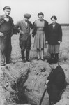 Jewish survivors watch as Poles exhume a mass grave in Sokolow Podlaski.