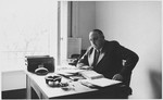 Albert Nussbaum, Comissioner of Emigration for Luxembourg and Director of Transmigration for the American Joint Distribution Committee, poses in his office in Lisbon.