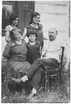 The Topilsky family poses in their garden outside their home in Lodz.