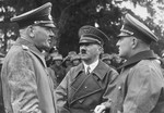 Hitler with General Blomberg and his Adjutant Colonel Hossbach, speaking about maneuvers.