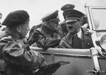 Hitler at maneuvers with his assistant Col. Hossbach.