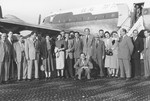 Jewish DPs pose in front of an El Al airplane prior to their departure for Israel.