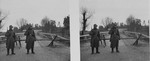 Stereoscopic photograph of two German sentries standing guard in front of a gate along the demarcation line between Soviet and German occupied Poland.