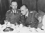 Governor-General Hans Frank hosts Reichsfuehrer SS Heinrich Himmler at a dinner held at Wawel castle during his visit to Krakow.