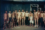 Group portrait of naked survivors in the Mauthausen concentration camp.