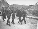 Reichsfuehrer SS Heinrich Himmler and his entourage inspect the Wiener Graben quarry during an official tour of the Mauthausen concentration camp.