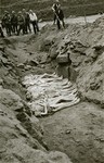 Austrian civilians bury former inmates in a mass grave in the Mauthausen concentration camp.