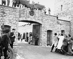 Spanish survivors take down the Nazi eagle that hangs above the entrance to the SS compound in Mauthausen on the day of liberation.