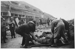 American soldiers oversee German civilians forced to clear away corpses in the Nordhausen concentration camp.