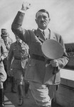 Chancellor Adolf Hitler salutes the crowd assembled in the Zeppelinfeld at Reichsparteitag (Reich Party Day) ceremonies in Nuremberg.