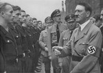 Adolf Hitler and Robert Ley review a unit of DAF (Deutsche Arbeitsfront) workers at Reichsparteitag (Reich Party Day) ceremonies in Nuremberg.
