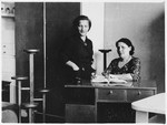 Two Polish Jewish women pose in their furniture shop.
