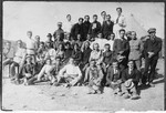 Pioneers in Palestine pose on a sandy plot where they hope to erect a new kibbutz.