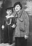 Studio portrait of Marie Torres and her younger daughter Dolly dressed in a sailor suit.