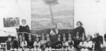 Students in a Jewish kindergarten in Kovno.  Helen Verblunsky is seated seventh from the left in the striped shirt.
