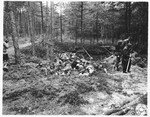 German civilians exhume bodies from a mass grave in Stamsried, Germany.