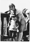 A young Jewish boy poses with his kindergarten teacher in Peine, Germany.
