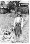 A Jewish teenager poses in the backyard of her home in Tacovo.