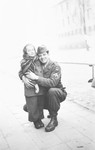 A Jewish American serviceman, hugs Edith, a young girl inf the Wetzlar displaced persons' camp.