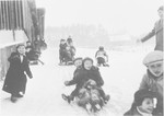 Children go sledding in the Ulm displaced persons' camp.