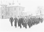 A group of religious boys line up in the snow in the Ulm displaced persons' camp.