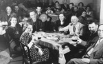 Jewish refugees on board the St. Louis raise their glasses in a toast.