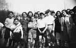 Group portrait of German-Jewish children staying at the Ons Boschhious children's home in Driebergen before going on a trip to see a soccer game in Soesterberg, Holland.