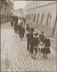 Under the supervision of American soldiers, German civilians from Neunburg vorm Wald carry wooden coffins containing the bodies of Hungarian, Russian and Polish Jews to the town cemetery for proper burial.