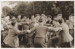 Jewish DP youth who were members of the Buchenwald children's transport dance the hora at the OSE (Oeuvre de Secours aux Enfants) children's home in Ecouis.