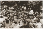 Jewish DP youth who were members of the Buchenwald children's transport listen to a speaker at an outdoor meeting at the Ecouis children's home.
