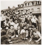 Members of the Buchenwald children's transport pose outside the Ecouis children's home.