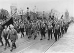 Adolf Hitler, Hermann Goering, Julius Streicher, and other "old fighters," retrace the route of the march in 1923 during ceremonies commemorating the eleventh anniversary of the "beer hall putsch."