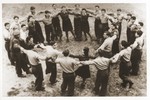 Members of the Kibbutz Hatichiya Nocham hachshara dance a hora in the Foehrenwald displaced persons camp.