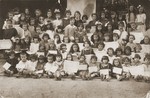 Group portrait of children holding their diplomas at a school in Bitola, Macedonia.