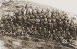 A Yugoslav military unit that included Jewish recruits, poses on a barren hillside.