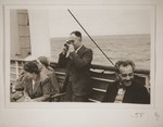 Ernst Vendig shoots photographs on board the St. Louis.